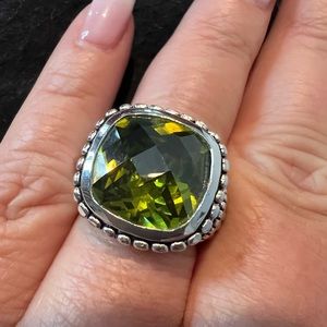 Silver coated with large green stone. Size 7.75 worn once